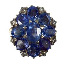 Vintage 8.90ct Sapphire and Diamond Cluster Ring; nine oval sapphires in a floral design, accented with brilliant cut diamonds, in 18ct white and rose gold