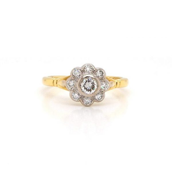 Vintage Diamond Flower Cluster Ring; nine sparkling diamonds collet-set, 0.40 carat total, mounted in 18ct Yellow Gold