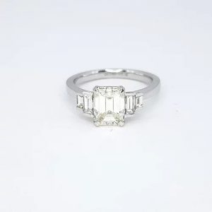 Emerald Cut Diamond and Platinum Engagement Ring; 1.54 carat emerald-cut diamond flanked by 0.43cts graduated baguette cut diamonds
