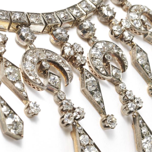 Antique Victorian Old Cut Diamond Fringe Necklace, 34.00 carat total, set with old-cut, kite and crescent-shaped diamonds, Mounted in silver-upon-gold. Circa 1880