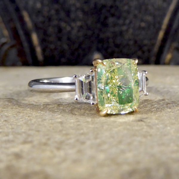 Fancy Light Green 2.40ct Diamond and White Diamond Three Stone Ring