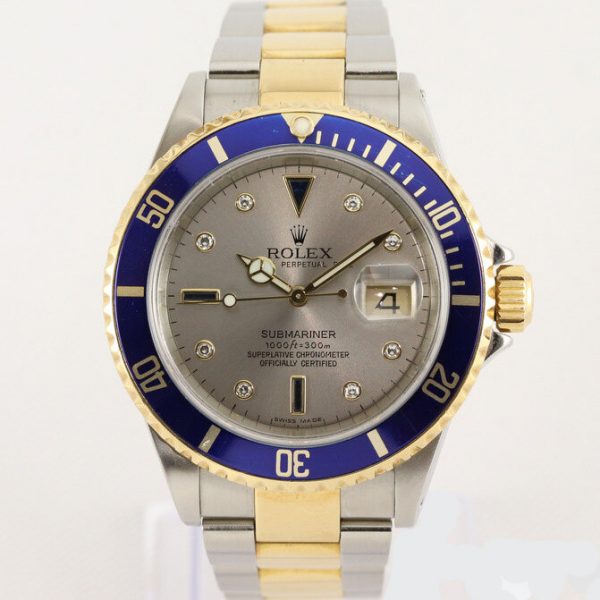 Rolex Submariner Date 16613 Serti Dial Steel and Gold Automatic 40mm Wristwatch Slate Serti factory dial - 8 diamond and 4 sapphire hour markers, steel and gold Oyster bracelet with fold-over clasp, with gold through the buckle, with Box and Papers