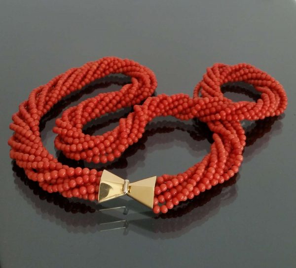 Vintage Multi Strand Coral Necklace with 18ct Gold Italian Clasp; comprising of eight strands of 4mm coral beads on 18ct yellow gold Italian feature clasp. Circa 1970s