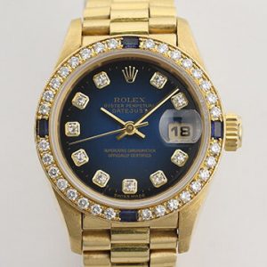 Rolex Oyster Perpetual Lady-Datejust 69088 in 18ct Yellow Gold with Original Diamond Dial and Bezel, Blue Vignette Serti dial, automatic movement, 18ct President bracelet with Crownclasp, with Rolex box and papers