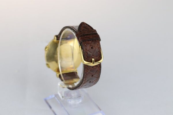 Jaeger LeCoultre Memovox Alarm Vintage 18ct Yellow Gold 35mm Manual Watch; on a brown leather strap, Circa 1950s-1960s
