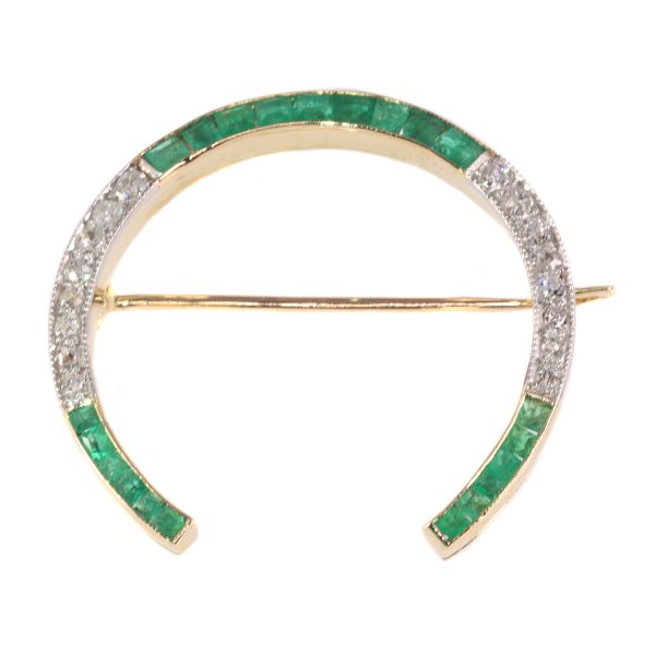 antique Art Deco diamond and emerald horseshoe brooch mounted