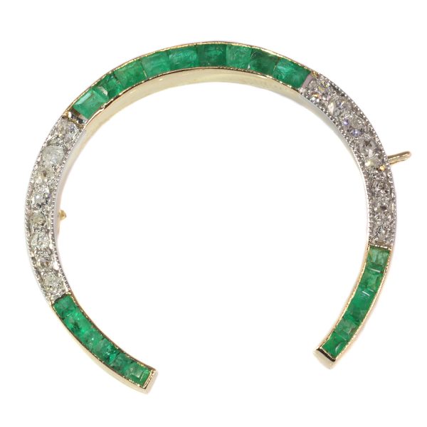 antique Art Deco diamond and emerald horseshoe brooch mounted