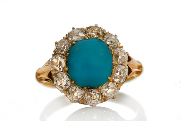 Antique Victorian Turquoise and Old Cut Diamond Cluster Ring; central 2.50ct round cabochon cut turquoise surrounded by 1.65cts old cut diamonds, in 15ct yellow gold, Circa 1870s