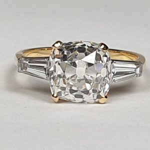 Antique 19th Century Cushion Cut 3.76ct Diamond Ring; central 3.76 carat cushion-cut diamond flanked by tapered baguette-cut diamonds to the shoulders, in 18ct yellow gold