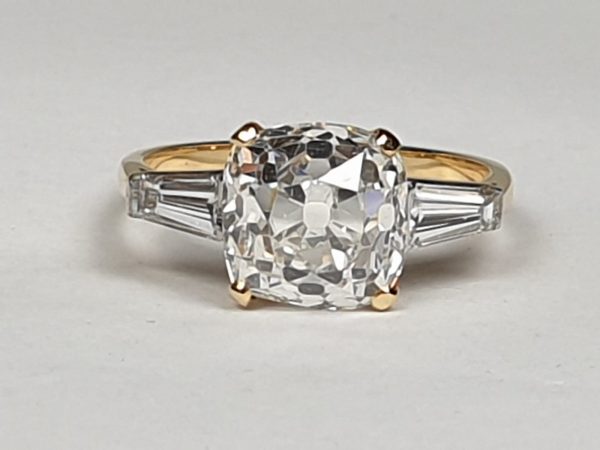Antique 19th Century Cushion Cut 3.76ct Diamond Ring; central 3.76 carat cushion-cut diamond flanked by tapered baguette-cut diamonds to the shoulders, in 18ct yellow gold