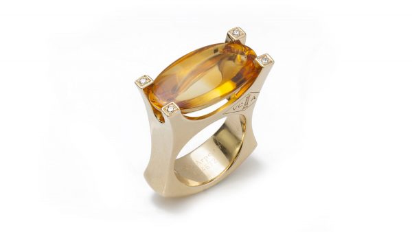Vintage Van Cleef and Arpels Citrine, Diamond and 18ct Yellow Gold Ring; set with a large 18 carat oval cabochon citrine accented with diamond set corners to the mount, Circa 1990s