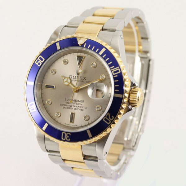 Rolex Submariner Date 16613 Serti Dial Steel and Gold Automatic 40mm Wristwatch Slate Serti factory dial - 8 diamond and 4 sapphire hour markers, steel and gold Oyster bracelet with fold-over clasp, with gold through the buckle, with Box and Papers