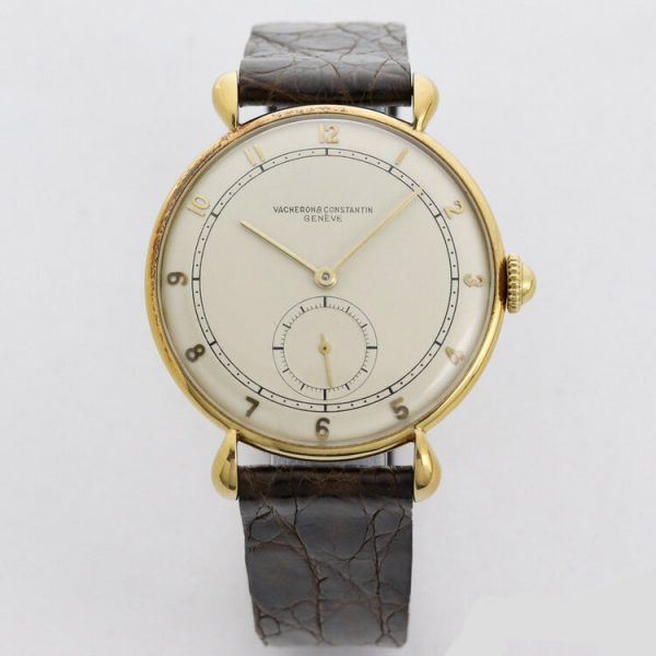 Vacheron Constantin Vintage 1950s Manual 18ct Yellow Gold Watch; 36mm gold case with white dial, Arabic numerals, small seconds and acrylic crystal, on a Vacheron Constantin brown leather strap with gold buckle