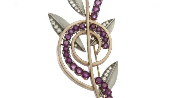 Tiffany and Co Vintage Ruby and Diamond Retro Floral Brooch, crafted from platinum and 14ct yellow gold, set with rubies and diamonds. USA, Circa 1940s