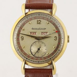 Vintage Jaeger LeCoultre Triple Calendar 18ct Yellow Gold 36mm Manual Watch; silver dial, weekday, date and month functions, small seconds, tear drop lugs and acrylic crystal, on a brown leather strap with pin buckle, Circa 1950s