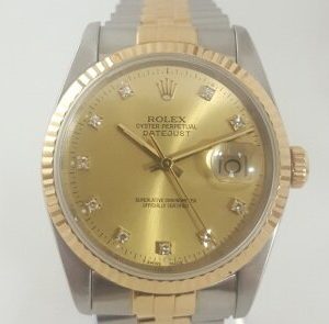 Rolex Datejust Steel and Gold 36mm Automatic with Original Diamond Dial and Box; with champagne dial, factory-set diamond hour markers, a magnified date aperture at the 3 o'clock position, screw-locked crown and quick set date, steel and gold Jubilee bracelet
