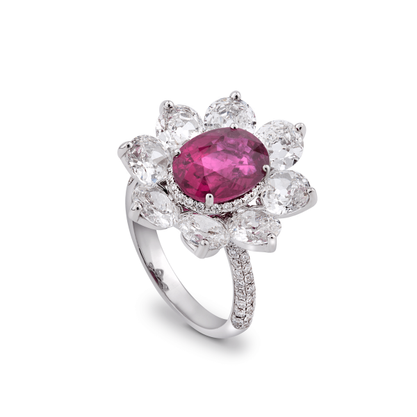 Burmese Ruby and Old Cut Diamond Floral Cluster Ring; central 3.69 carat Burmese ruby framed by 8 round old-cut diamonds, accented by 94 pave set diamonds. Total diamond weight 4.46cts