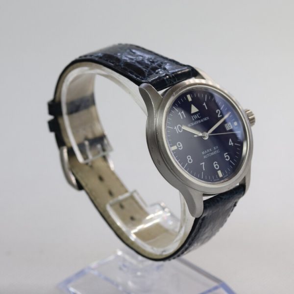 IWC Pilot Aviator Mark II Limited Edition Automatic Watch; 36mm titanium case with blue dial, Arabic numerals and date aperture, on a leather strap with platinum buckle, comes with IWC box. One of 500 examples made in 1993.