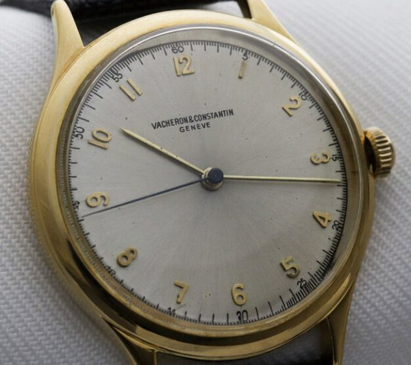 Vacheron Constantin Vintage 1950s Manual 18ct Yellow Gold Screw Back 35mm Gents Watch; with rare silver dial, Arabic numerals, centre seconds and acrylic crystal, screw-down case back and dust cover, on a black leather strap