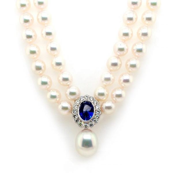 Stunning two row pearl choker necklace with a central oval faceted 3.25ct sapphire and diamond cluster clasp mounted in 18ct white gold, and a South Sea pearl drop
