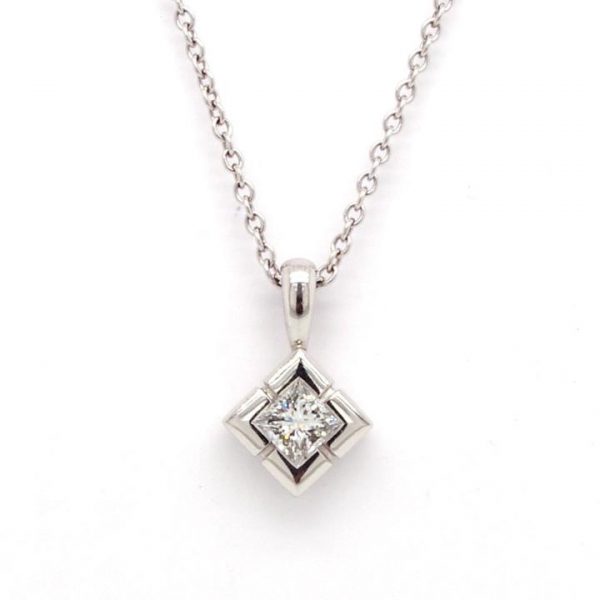 Diamond Single Stone Pendant; platinum diamond-shaped mount set with a single 0.25 carat round diamond, on an 18ct white gold 20" trace chain