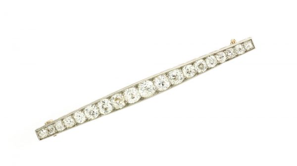 Art Deco Old Cut Diamond Bar Brooch; set with 1.20 carats of graduating old-cut diamonds. Mounted in platinum and backed with 18ct yellow gold. Circa 1920s