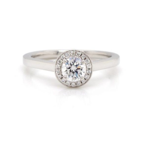 Diamond and Platinum Halo Cluster Target Ring; central 0.50ct round brilliant-cut diamond with a pavé-set diamond surround, G/H colour and VS clarity