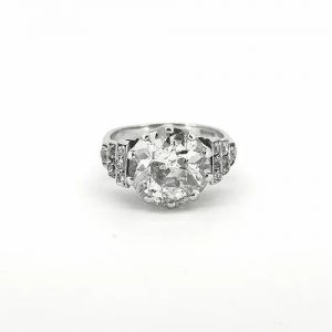 Vintage Old Cut Diamond Engagement Ring; central 4.10 carat old-cut diamond, ten-claw set, diamond set shoulders in a graduated geometric step design