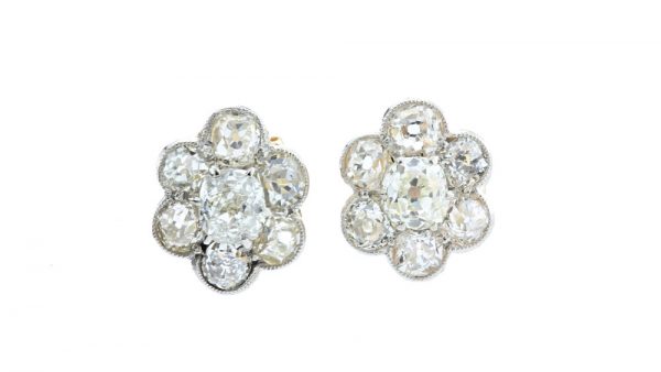 Antique Victorian Old Cut Diamond Floral Cluster Stud Earrings; set with 1.44 carats old cut diamonds arranged in a flower cluster design, in 18ct yellow gold, 19th century, Circa 1860s