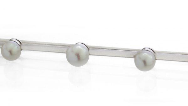 Boucheron Art Deco Platinum Bar Brooch set with five natural freshwater pearls. Made in France, Circa 1920s
