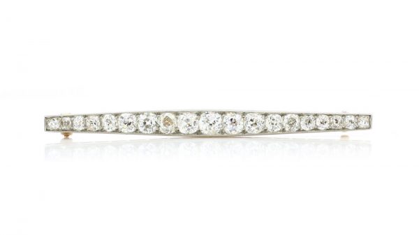 Art Deco Old Cut Diamond Bar Brooch; set with 1.20 carats of graduating old-cut diamonds. Mounted in platinum and backed with 18ct yellow gold. Circa 1920s