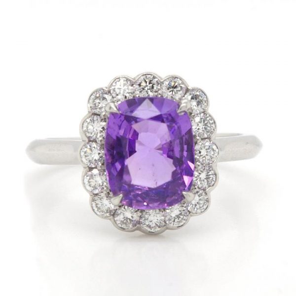 Cushion Cut Purple Sapphire and Diamond Cluster Ring; beautiful and unusual unheated 2.27 carat purple cushion cut sapphire set within a surround of 0.43cts collet-set diamonds, in platinum, with certificate