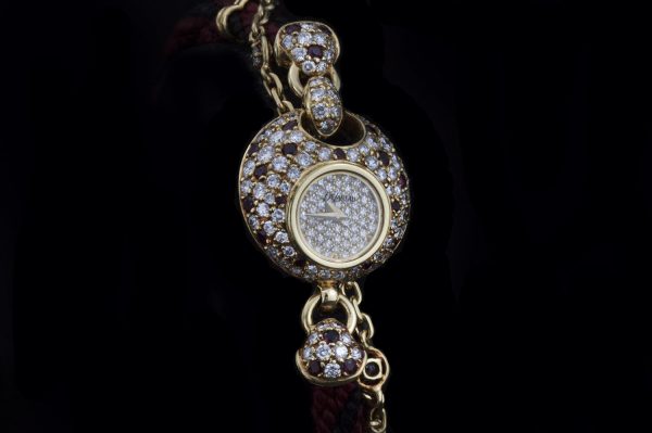 Vintage DaLaneau 18ct Yellow Gold 22mm Ladies Bracelet Watch with Diamonds and Rubies; set with 4.00 carats of diamonds and 0.66 carats of rubies. Circa 1980s