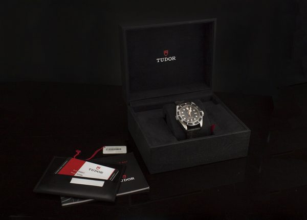 Tudor Heritage Black Bay Automatic Chronometer Watch; 41mm stainless steel case, black dial with luminescent hands and hour markers, unidirectional rotating bezel, and screw-down crown, on black leather strap with deployment buckle, certified, with box and papers