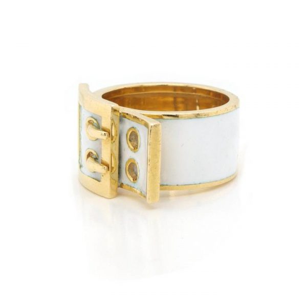Vintage Kutchinsky White Enamel and 18ct Yellow Gold Buckle Ring; 18ct gold ring in the design of a buckle, with white enamel detailing. Circa 1970s.
