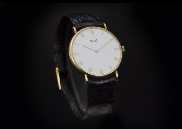 Piaget Classique 18ct Yellow Gold 33mm Manual Winding Watch; white dial, with original warranty / purchase document dated 1992 from Piaget Boutique Monaco - Avenue des Beaux-Arts