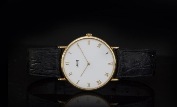 Piaget Classique 18ct Yellow Gold 33mm Manual Winding Watch; white dial, with original warranty / purchase document dated 1992 from Piaget Boutique Monaco - Avenue des Beaux-Arts