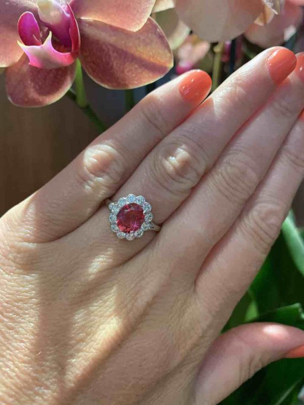 Padparadscha sapphire and diamond cluster ring
