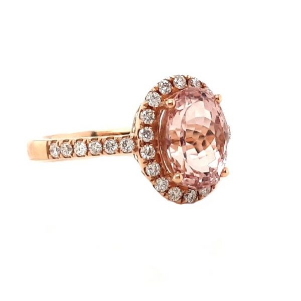 Morganite and Diamond Oval Cluster Ring; oval faceted 2.54 carat morganite surrounded by a diamond halo, diamond set shoulders, in 18ct rose gold