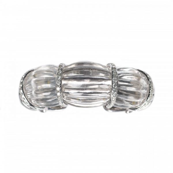 Rock Crystal and Diamond Cuff Bangle Bracelet; modern carved fluted rock crystal with four 18ct white gold spacer sections set with 2.50cts round brilliant-cut diamonds, 18ct white gold ends