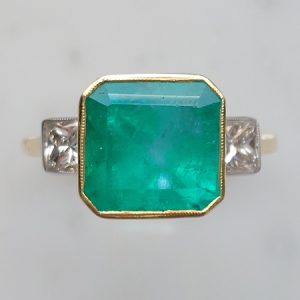 Octagonal Cut Emerald and Diamond Three Stone Ring
