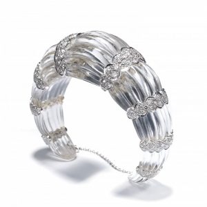 Rock Crystal and Diamond Cuff Bangle Bracelet; modern fluted rock crystal bangle bracelet carved from one single piece of rock crystal, with eight scalloped 18ct white gold sections set with 7.00 carats round brilliant-cut diamonds