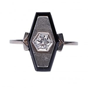Art Deco French Old Cut Diamond and Onyx Lozenge Plaque Ring; hexagonal ring with central 0.25ct old cut diamond on a matt ground with a fine onyx border. Set in white gold, Circa 1925