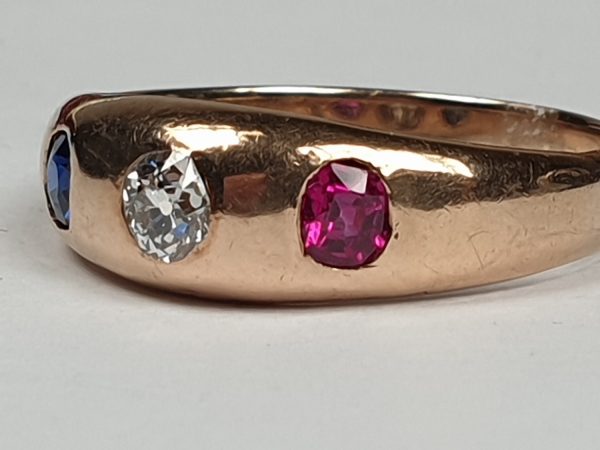 Antique Victorian Cushion Cut Diamond, Sapphire and Ruby Three Stone Gypsy Ring in Gold