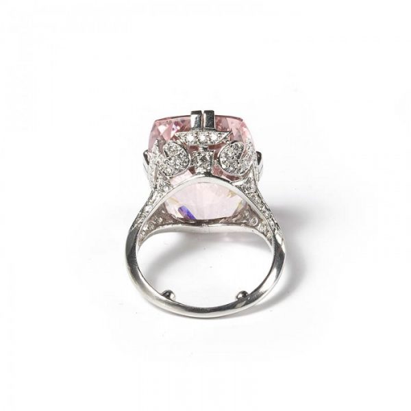 Art Deco Style Pink Kunzite, Diamond and Platinum Dress Ring; featuring a modern 16.50 carat cushion-cut pink kunzite accented by round brilliant-cut diamonds set gallery and shoulders totalling 2.00 carats