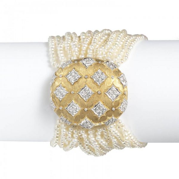 Contemporary Multi Row Pearl Bracelet with Diamond set 18ct Gold Clasp; oval gold clasp decorated with quatrefoils of 2.75cts round brilliant cut diamonds, on a cultured seed pearl bracelet comprising of twenty-one rows. Length 190mm