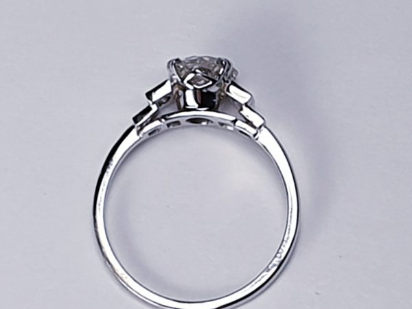 Vintage 1.06ct Old Cut Diamond and Platinum Engagement Ring; featuring a 1.06 carat G colour VS1 clarity old European transitional cut diamond with baguette and radiant-cut diamond shoulders, in platinum