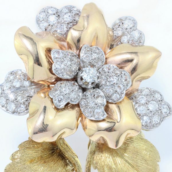 Art Deco Old Cut Diamond Floral Brooch; 2.10 carat total, in 18ct yellow gold with textured stem and leaves