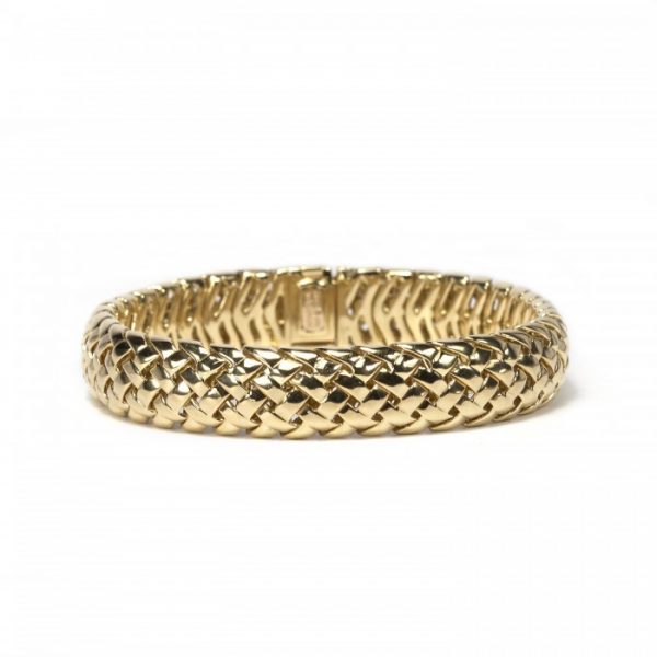 Tiffany and Co Vannerie 18ct Yellow Gold Bracelet; comprised of a domed lattice design in 18ct yellow gold, with a folding clasp. Stamped Tiffany & Co., 750, 1995