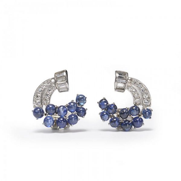 Vintage Sapphire, Diamond and Platinum Cluster Earrings; set with 5.00 carats cabochon-cut sapphires and 1.80 carats single-cut and baguette-cut diamonds, in a scroll design. Circa 1950s